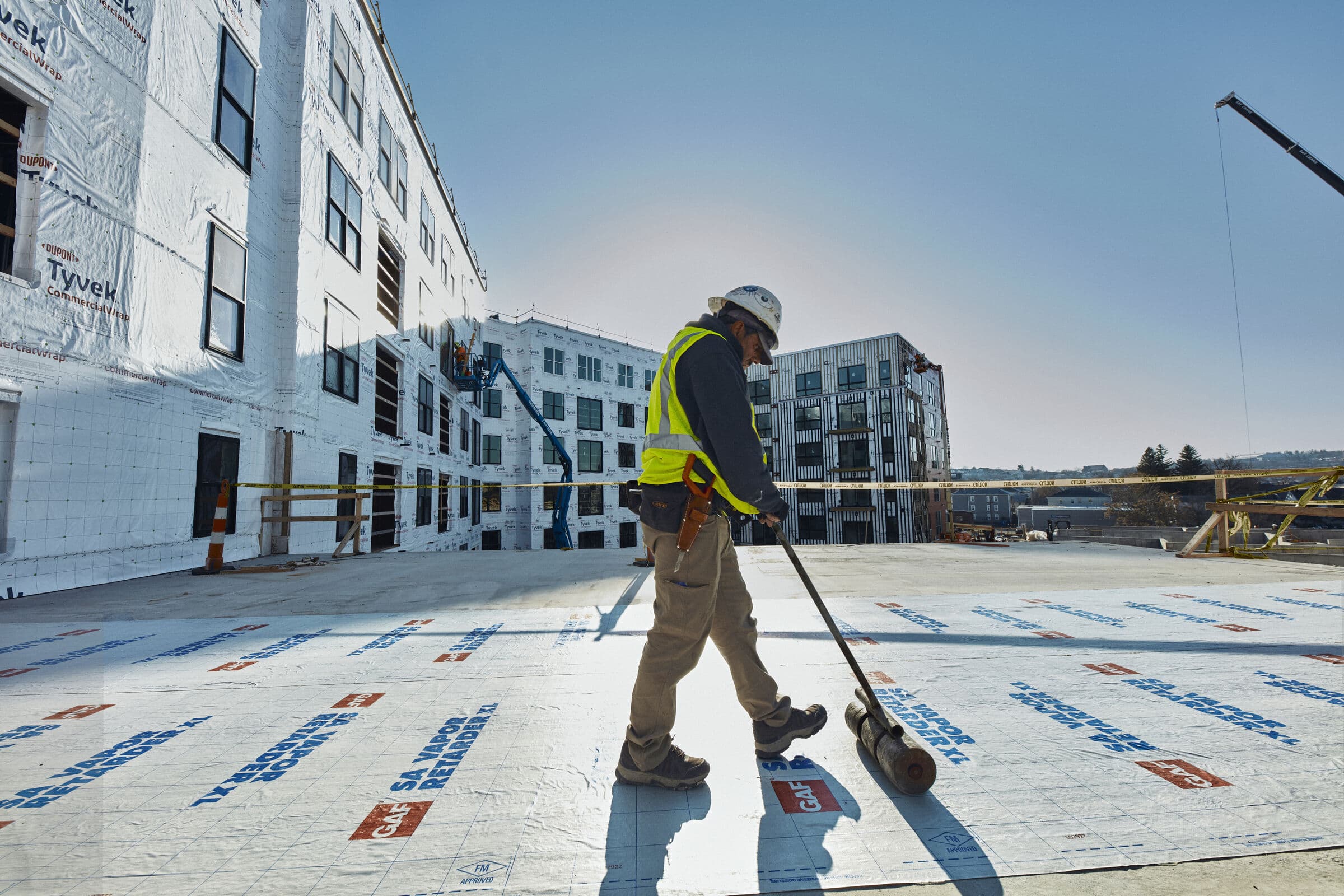 Commercial flat roof membrane installation in progress