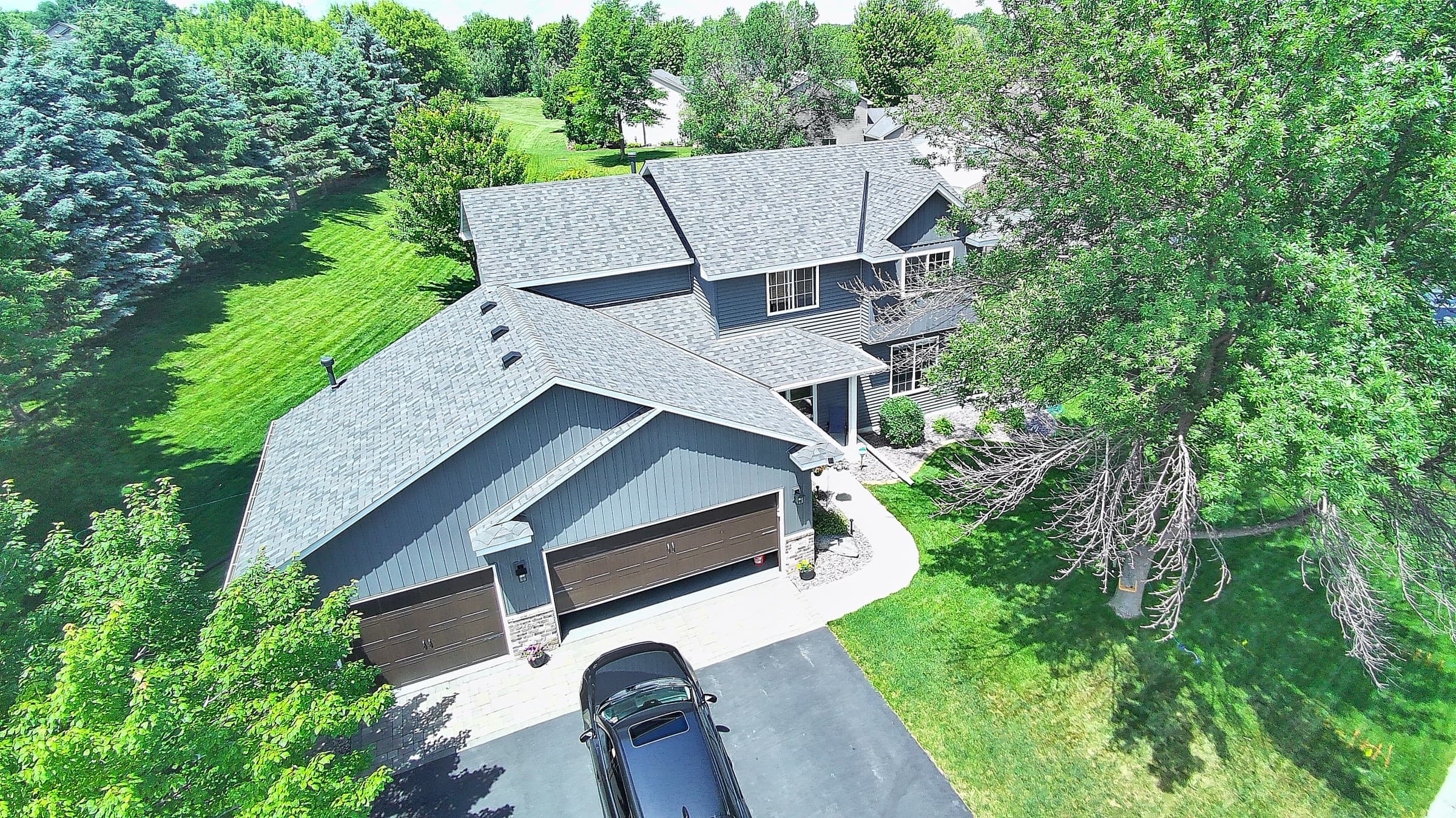 Aerial view of a completed Ace roof replacement on a Twin Cities home